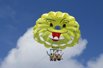 a parasailing flying in the air