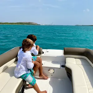 a person sitting on a boat in the water